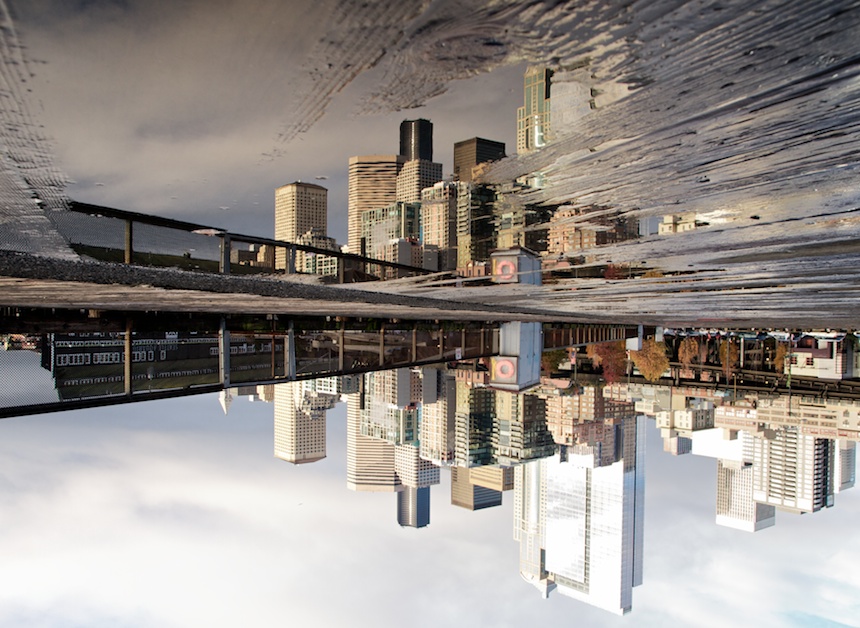 Seattle Skyline reflected in puddle